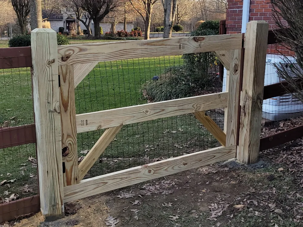 New fence and gate tied into an existing older fence line by RB Fence